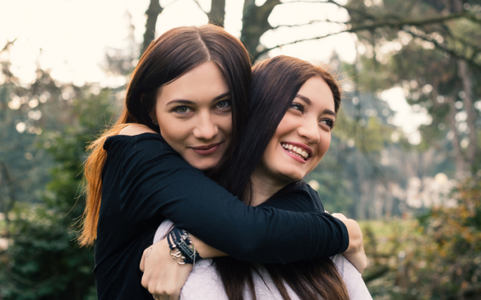 Two Sisters Hugging