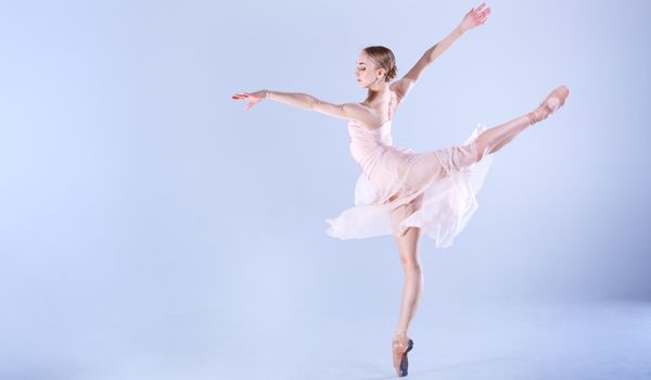 dancer on pointe in costume practicing strengthening her ankles